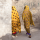 Two women walk in an alley in a neighborhood in Bandar Abbas, a port city on the southern coast or Iran.